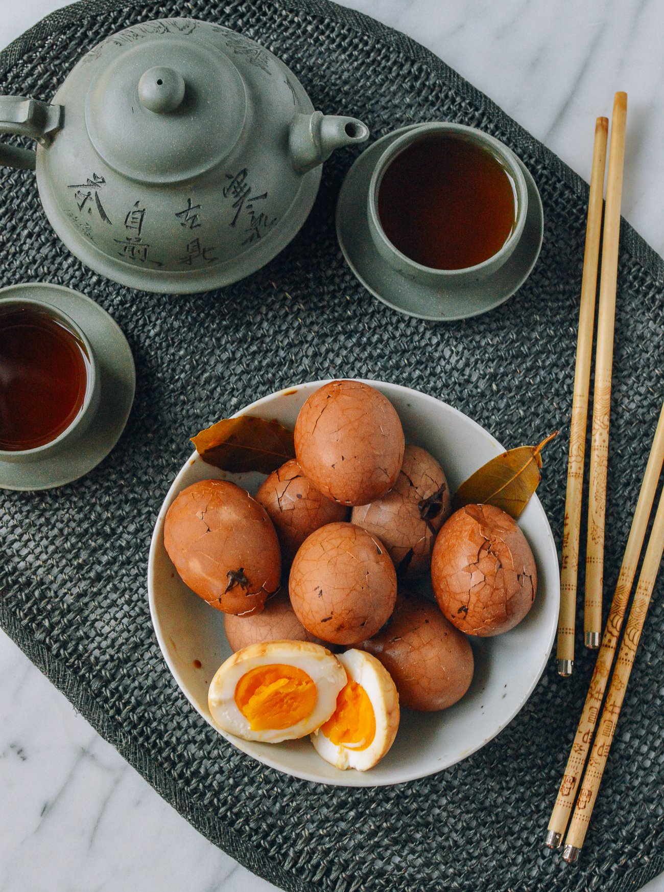 bowl of tea eggs served with tea