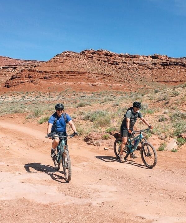 Bill and friend biking in Moab, Utah - thewoksoflife.com